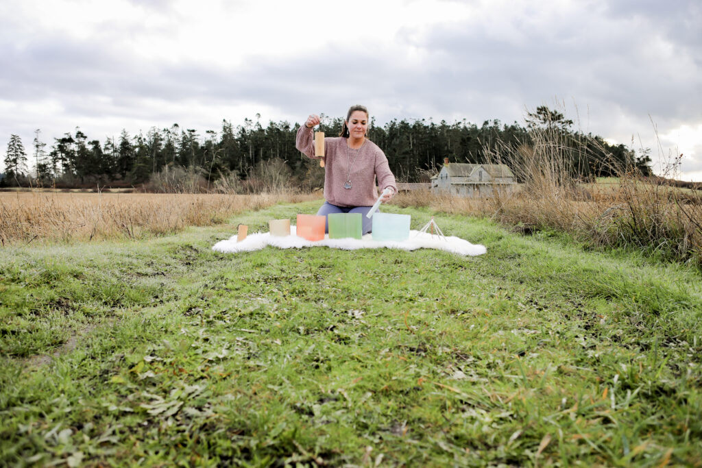 A person conducting a sound bath.